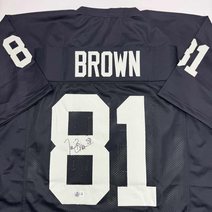 Autographed/Signed Tim Brown Oakland Black Football Jersey Beckett BAS COA