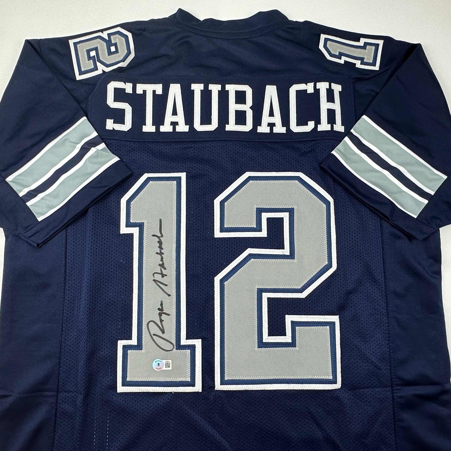 Autographed/Signed Roger Staubach Dallas Blue Football Jersey Beckett BAS COA