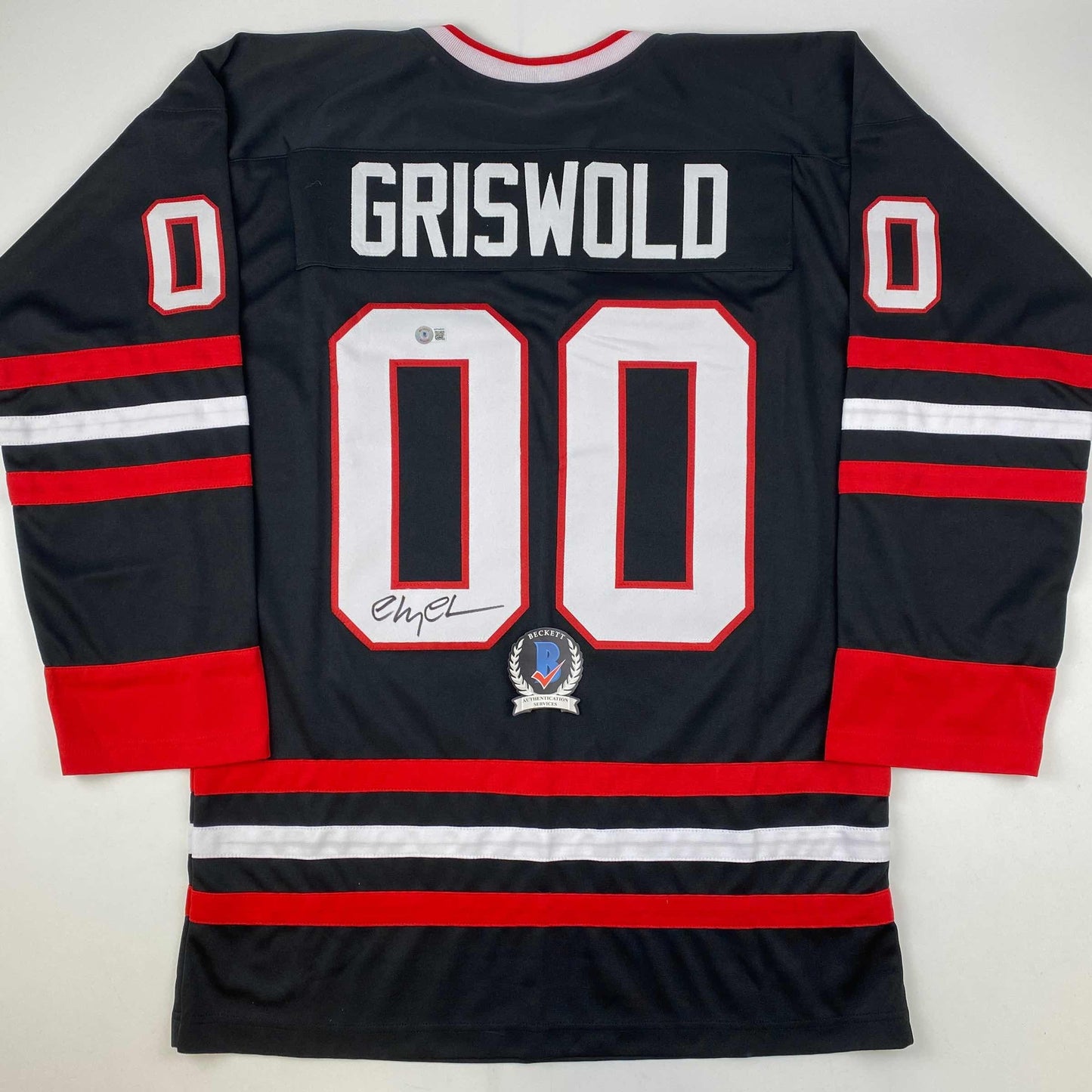 Autographed/Signed Chevy Chase Clark Griswold Christmas Vacation Movie Chicago Black Hockey Jersey Beckett BAS COA