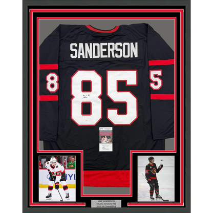 Framed Autographed/Signed Jake Sanderson 35x39 Ottawa Black Hockey Jersey JSA COA