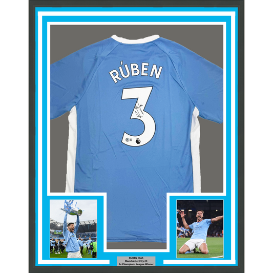 Framed Autographed/Signed Ruben Dias 35x39 Manchester City Blue Soccer Futbol Jersey Beckett BAS COA #2