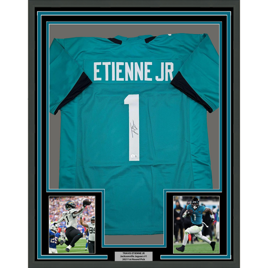 Framed Autographed/Signed Travis Etienne Jr. 35x39 Jacksonville Teal Football Jersey Beckett BAS COA
