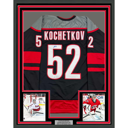 Framed Autographed/Signed Pyotr Kochetkov 35x39 Carolina Black Hockey Jersey JSA COA