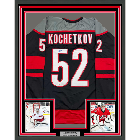 Framed Autographed/Signed Pyotr Kochetkov 35x39 Carolina Black Hockey Jersey JSA COA