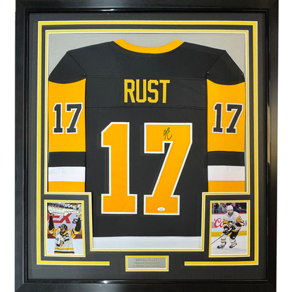 Framed Autographed/Signed Bryan Rust 35x39 Pittsburgh Black Hockey Jersey JSA COA