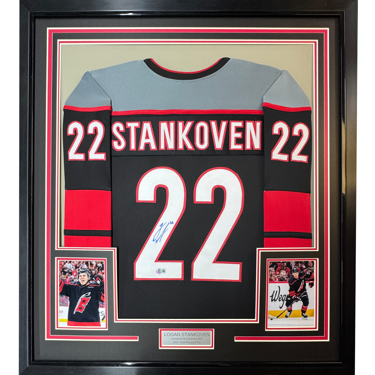 Framed Autographed/Signed Logan Stankoven 35x39 Carolina Black Hockey Jersey Beckett BAS COA