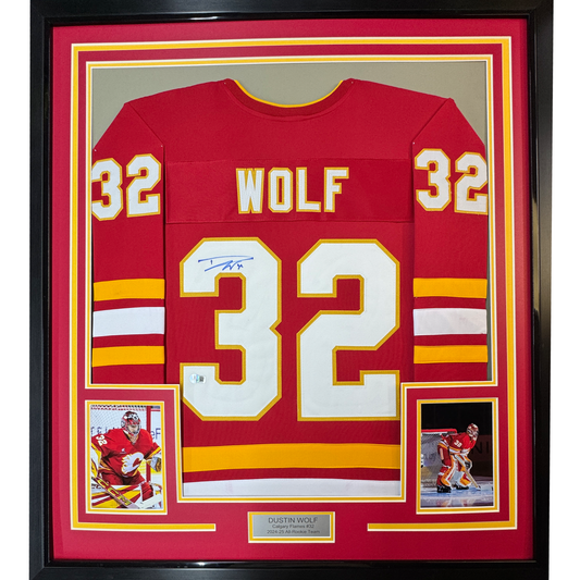 Framed Autographed/Signed Dustin Wolf 35x39 Calgary Red Hockey Jersey Beckett BAS COA