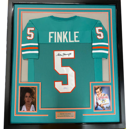 Framed Autographed/Signed Sean Young 35x39 Ray Finkle Miami Teal Ace Ventura Movie Football Jersey PSA/DNA COA