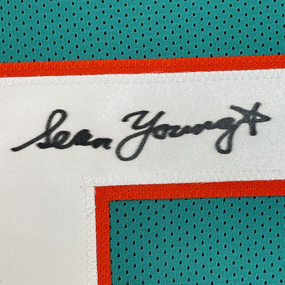 Framed Autographed/Signed Sean Young 35x39 Ray Finkle Miami Teal Ace Ventura Movie Football Jersey PSA/DNA COA