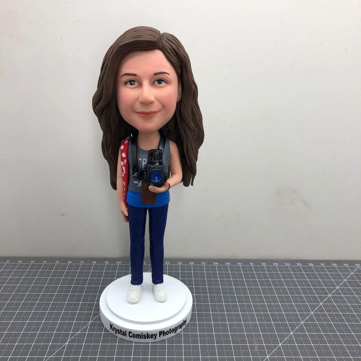 Custom photographer bobblehead with camera