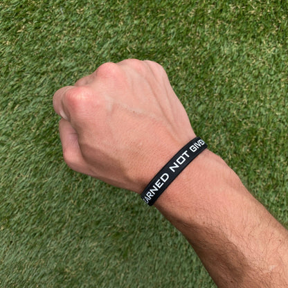 EARNED NOT GIVEN Wristband - Triathlete Store